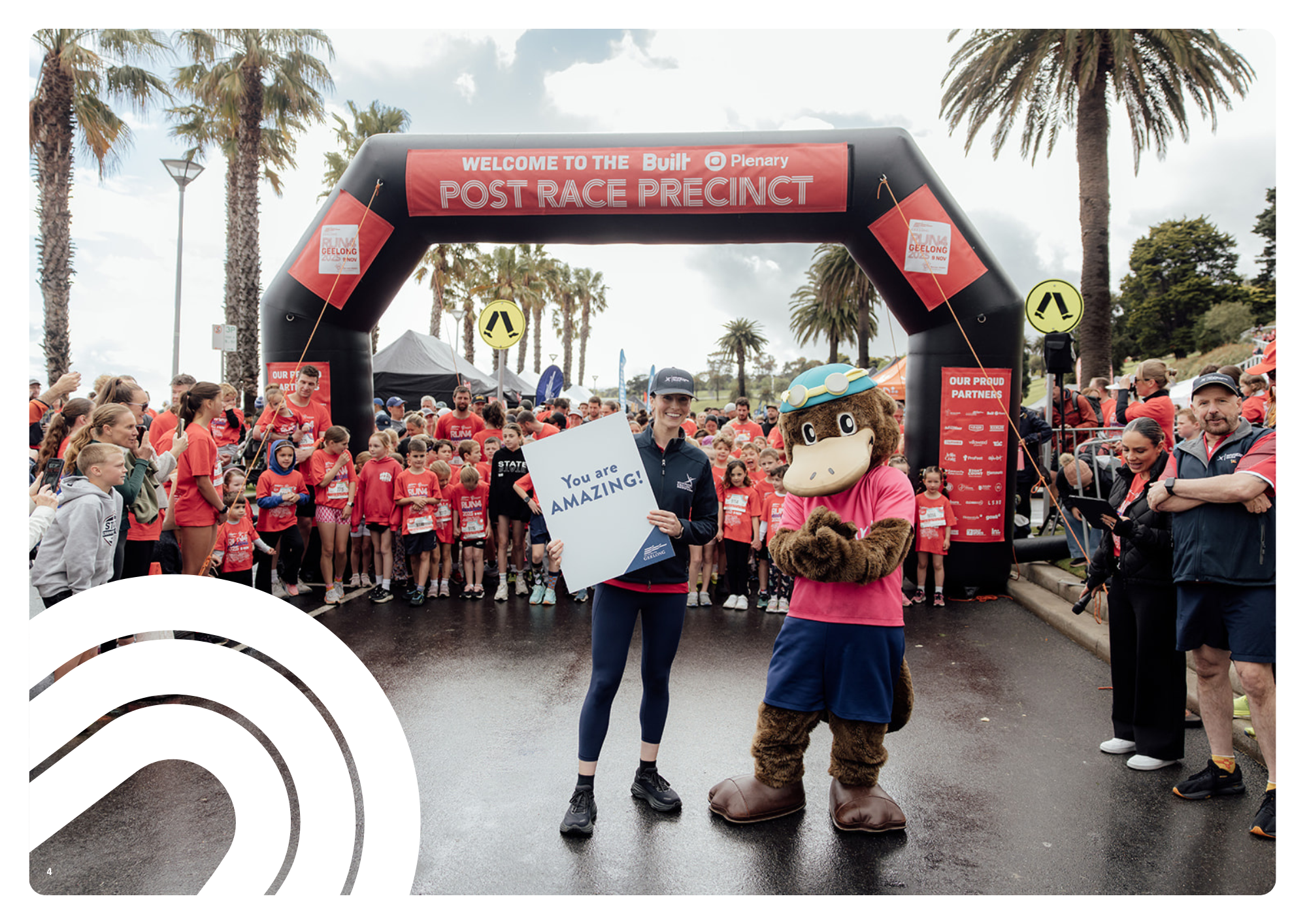 A volunteer and the Run4Geelong mascot with a You are amazing sign